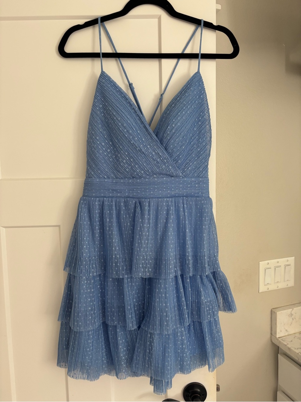 Periwinkle sparkly V-neck homecoming dress.